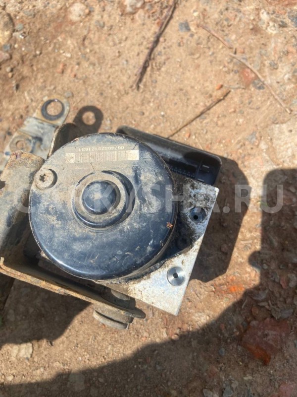 Блок ABS (насос) Mazda Demio IDY (2002—2007) Mazda 2 оригинальный номер 10096001063