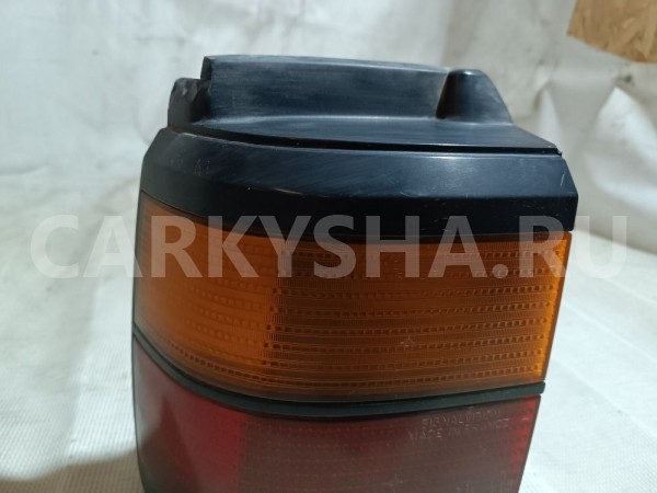 Фонарь задний наружный левый Volkswagen Passat оригинальный номер 333945111